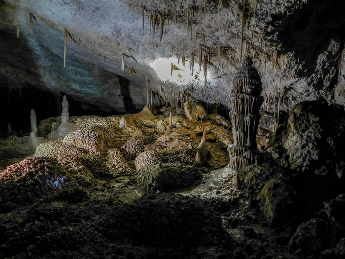 Erin Alberty  |  The Salt Lake TribuneThe "Crystal Ball" of Crystal Ball Cave towers over calcite formations known as "cowboy crystals" while stalactites dangle above. The cave is about 2 miles from the Nevada border, in Gandy, Utah.