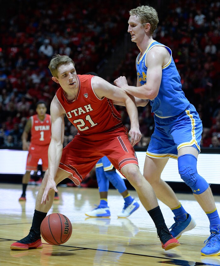 (Francisco Kjolseth  |  The Salt Lake Tribune)  Utah Utes forward Tyler Rawson (21) is pressured on his way down court as the University of Utah hosts UCLA in NCAA basketball at the Huntsman Center in Salt Lake City, Thursday, Feb. 22, 2018.