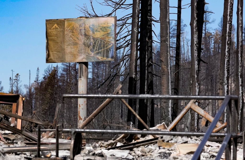 (Francisco Kjolseth | The Salt Lake Tribune) The remains of Canyonside Lodge and trail map at Eagle Point Resort, one of the smallest ski and snowboard areas in Utah, reveals what remains for one of the first areas to fall victim to the Cottonwood Fire in late June, pictured Thursday, July 9, 2026.