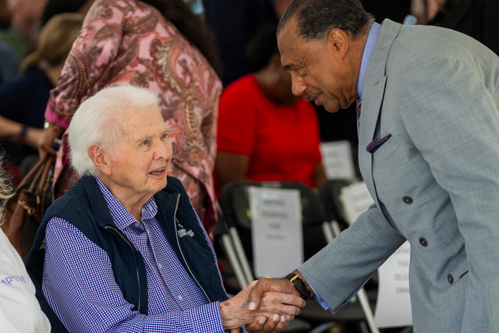 (Rick Egan | The Salt Lake Tribune) Ronald Spratling Jr., left, founder of Holladay Bank & Trust, shakes hands with Lenny Springs, board member of Redemption Bank at a ribbon-cutting ceremony on Sept. 10, 2025. Spratling died earlier this month at the age of 93.
