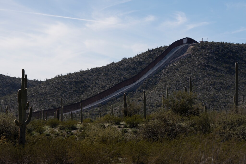 (Rebecca Noble | Special to The Tribune) The U.S.-Mexico fence sprawls through Organ Pipe Cactus National Monument in Lukeville, Arizona, in February 2024. The Church of Jesus Christ of Latter-day Saints has generally taken immigration-friendly positions.