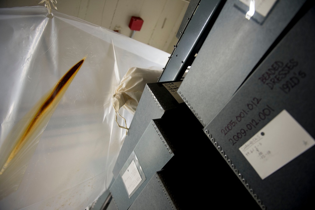 (Jeremy Harmon  |  The Salt Lake Tribune) A water-stained plastic covering is seen above boxes of historical clothing in the basement of the Rio Grande Depot, home of the Utah state historical offices, on Feb. 15, 2018.