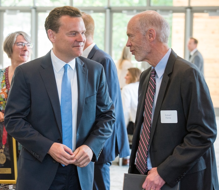 (Rick Egan  |  The Salt Lake Tribune)   Peter Huntsman talks to Robert Paine III  as the University of Utah named Paine as one of the six new Jon M. Huntsman Presidential Chairs, funded by the Huntsman Family Foundation, during a ceremony at the Alumni House, Tuesday, June 19, 2018.


