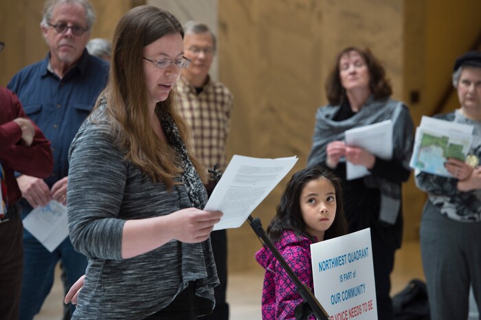 Scott Sommerdorf | The Salt Lake Tribune
Bobbi Brooks speaks as young Erin Cawley looks up as Utahns concerned about environmental health consequences and community impact from creating a state controlled inland port authority in Salt Lake CityÕs northwest quadrant held a press conference in the capitol rotunda, Sunday, March 4, 2018.