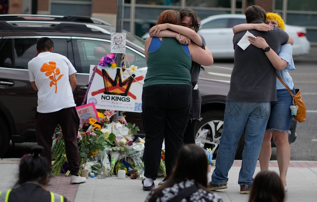 (Francisco Kjolseth | The Salt Lake Tribune) People mourn Arthur Folasa Ah Loo near the Wallace F. Bennett Federal Building in Salt Lake City where he was killed on Monday, June 16, 2025. Ah Loo was an innocent bystander shot during the “No Kings” demonstration downtown on Saturday night.