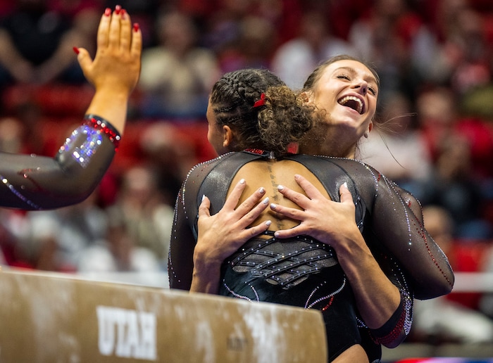 (Rick Egan | The Salt Lake Tribune)  Grace McCallum smiles after landing her dismount on the beam, in gymnastics action between Utah Red Rocks and Oregon State, at the Jon M. Huntsman Center, on Friday, Feb. 2, 2024.