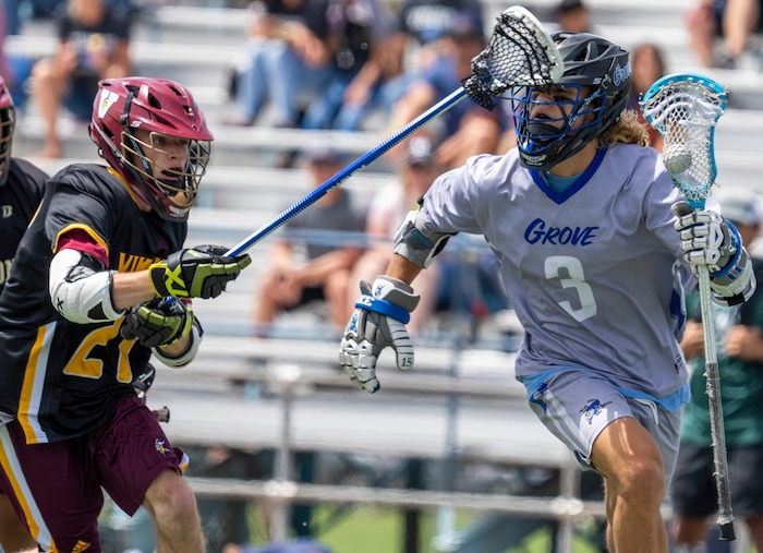(Rick Egan | The Salt Lake Tribune) Brigham Burbidge runs for Pleasant Grove, as Will Brady defends for Viewmont, in the Division C championship game between the Viewmont Vikings and the Pleasant Grove Vikings, in Layton, on Saturday, May 29, 2021.