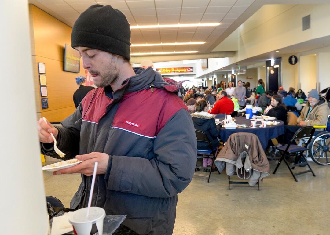 Leah Hogsten  |  The Salt Lake Tribune  Seth Anderton enjoys apple and pumpkin pie at the Utah Jazz and the Larry H. Miller Group sponsored annual “We Care – We Share” Thanksgiving Meal for local homeless and low-income families, Monday, Nov 19, 2018.