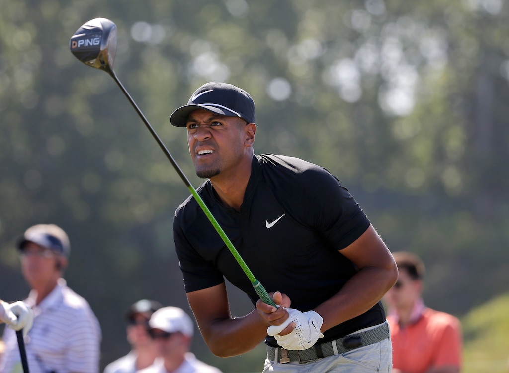 Tony Finau plays his shot from the ninth tee during the final round of the U.S. Open Golf Championship, Sunday, June 17, 2018, in Southampton, N.Y. (AP Photo/Seth Wenig)