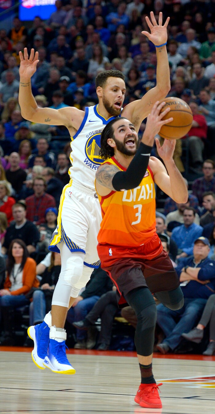 (Steve Griffin  |  The Salt Lake Tribune) Utah Jazz guard Ricky Rubio (3) gets fouled by Golden State Warriors guard Stephen Curry (30) during the Utah Jazz versus Golden State Warriors at Vivint Smart Home Arena in Salt Lake City Tuesday January 30, 2018.