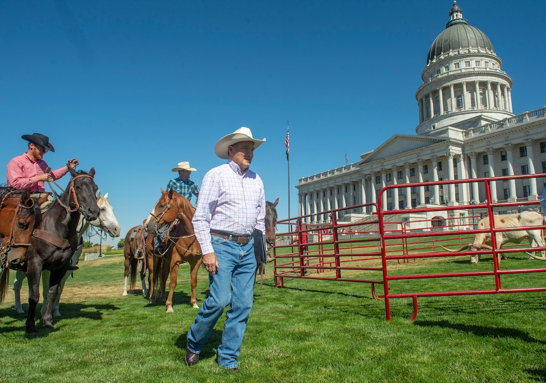 (Rick Egan  |  The Salt Lake Tribune)       Gov. Herbert makes his way to a news conference about the Days of 47 festivities, on the State Capitol lawn with long horn cattle in the background, Tuesday, July 16, 2019.