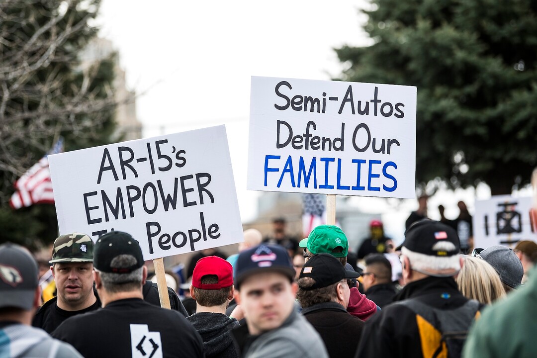 (Chris Detrick | The Salt Lake Tribune)  Participants hold signs during the March Before Our Lives rally near West High School in Salt Lake City Saturday, March 24, 2018.