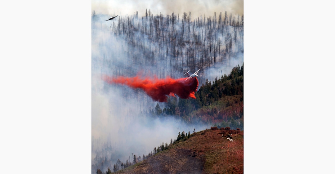 (Rick Egan | The Salt Lake Tribune) Two planes and helicopter work on the fire in Parleys Canyon, on Saturday, Aug. 14, 2021.