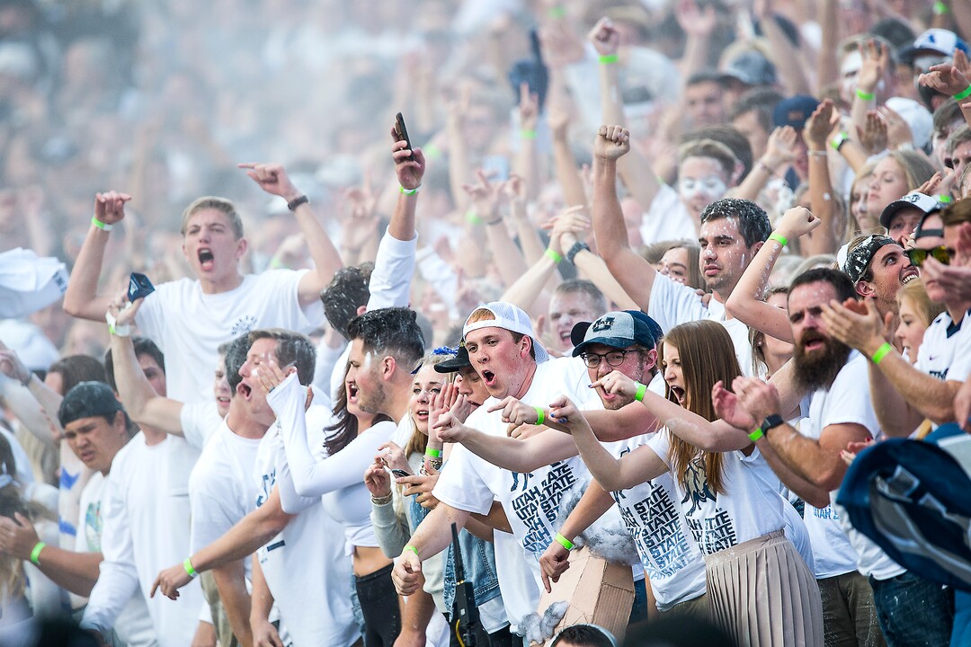 (Chris Detrick  |  The Salt Lake Tribune)  Utah State Aggies fans cheer after a touchdown during the game at Merlin Olsen Field at Maverik Stadium Friday, September 29, 2017.