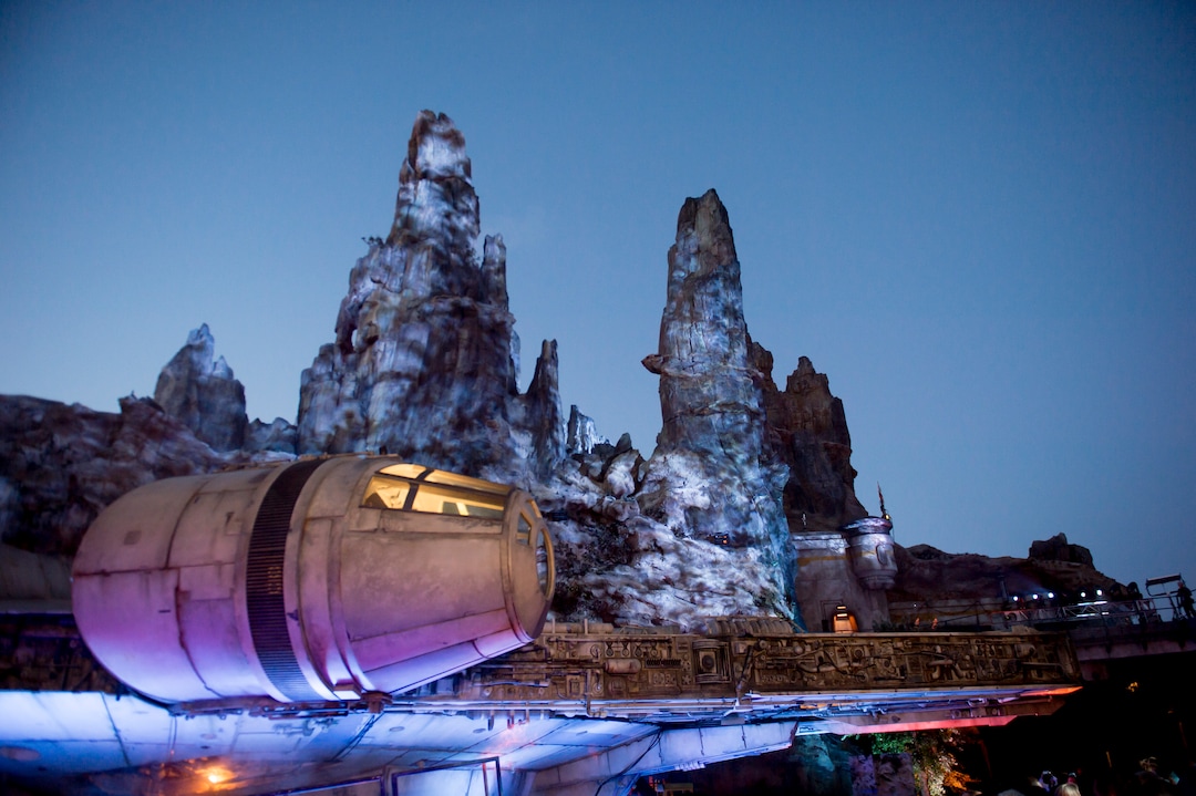 (Jeremy Harmon  |  The Salt Lake Tribune) The Millennium Falcon and the rest of Black Spire Outpost is bathed in eerie blue light after the sun set over at Star Wars: Galaxy's Edge in Anaheim, Ca. on Wednesday, May 29, 2019.