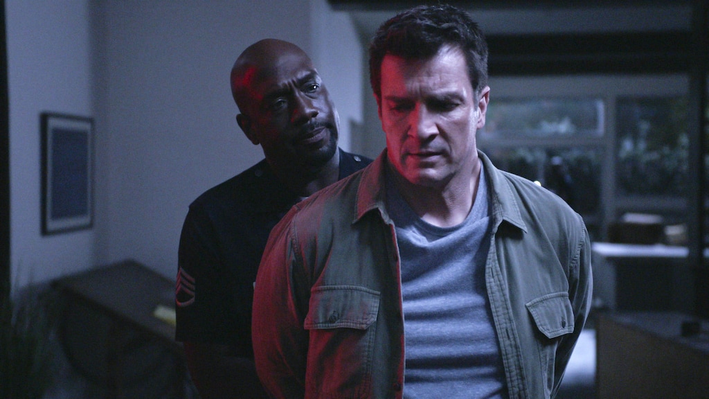 (Photo courtesy of ABC) Sgt. Grey (Richard T. Jones) takes Officer Nolan (Nathan Fillion) into custody in the Season 3 premiere of "The Rookie."