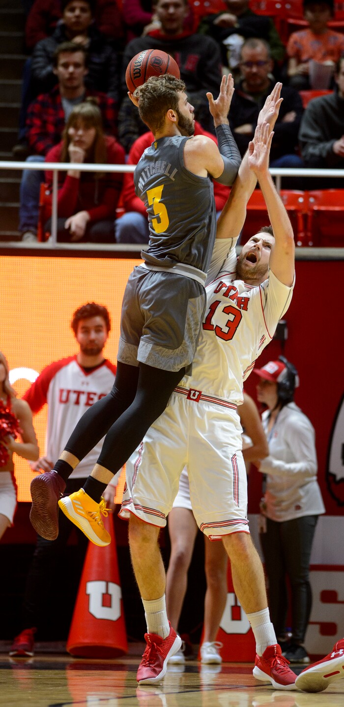 (Steve Griffin  |  The Salt Lake Tribune) Utah Utes forward David Collette (13) holds his ground as Arizona State Sun Devils forward Mickey Mitchell (3) leaps above him during the Utah Utes versus Arizona State Sun Devils at the Huntsman Center on the University of Utah campus in Salt Lake City Sunday January 7, 2018.