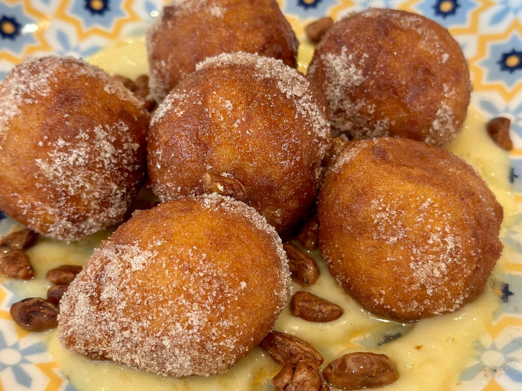 (Heather L. King) Ricotta doughnuts in a lemon curd with caramelized pecans, from Adelaide Urban Brasserie in the Le Meridien Hotel in downtown Salt Lake City.