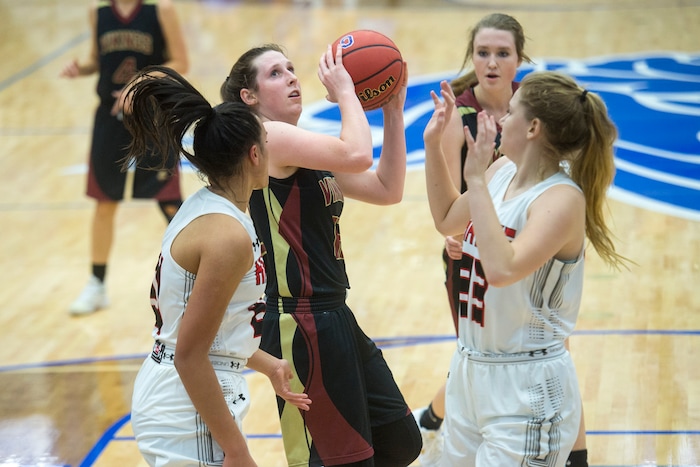 (Chris Detrick | The Salt Lake Tribune) Viewmont's Mercedes Staples (12) shoots past Alta's Eden Broederlow (21) and Alta's Marlee Albrecht (33) during the game at Pleasant Grove High School Thursday, November 30, 2017. Viewmont defeated Alta 65-44.