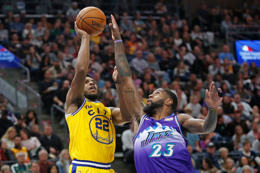Golden State Warriors forward Glenn Robinson III (22) shoots as Utah Jazz forward Royce O'Neale (23) defends in the first half during an NBA basketball game Friday, Nov. 22, 2019, in Salt Lake City. (AP Photo/Rick Bowmer)