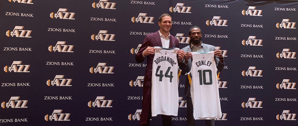(Eric Walden  |  The Salt Lake Tribune) New Jazz players Bojan Bogdanovic and Mike Conley show off their jerseys after being introduced to the media at the Encore Hotel in Las Vegas on Monday, July 8, 2019.