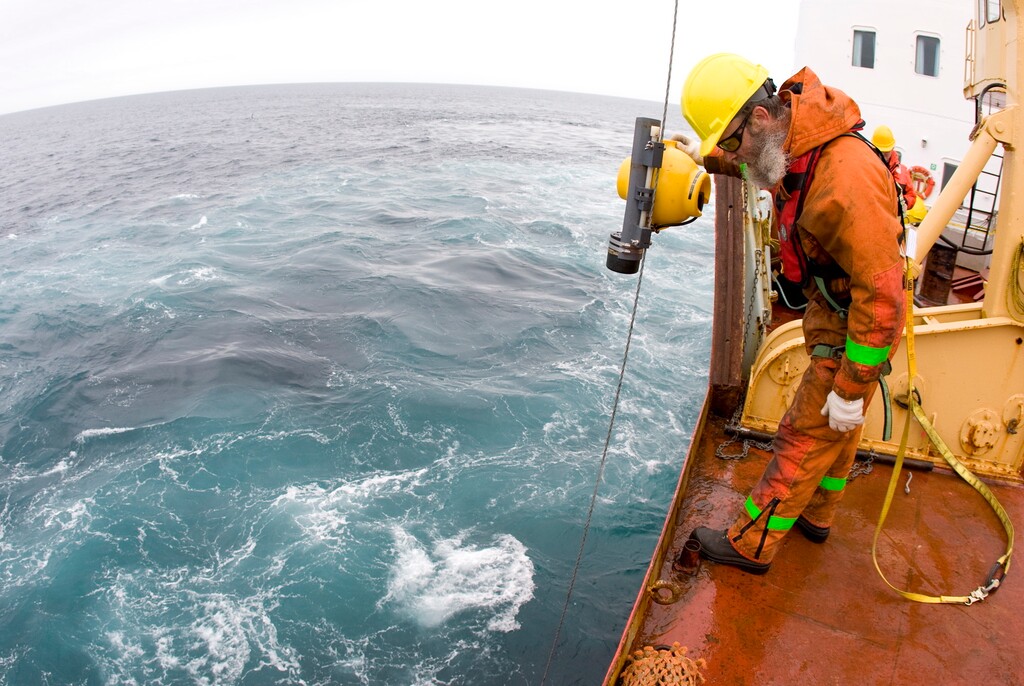 (Jonathan Hayward | The Canadian Press | The Associated Press) In this Tuesday, July 8, 2008 file photo, boatswain Bob Taylor, of Halifax, watches as a box corer is lowered from the Canadian Coast Guard icebreaker Louis S. St-Laurent in the Davis Strait. The device gathers mud and sediment from the bottom of the ocean floor. The Louis is on its annual voyage to Canada's Arctic which will include patrols through the Northwest Passage. In addition to serving the people of Canada's North the ship is carrying a team of scientists studying climate change and the health of Canada's three oceans.