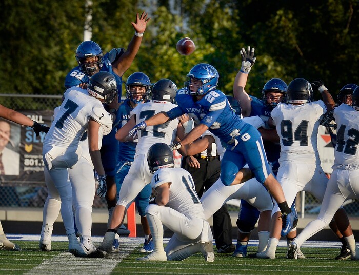 (Scott Sommerdorf | The Salt Lake Tribune) Pleasant Grove's Kainoa Maldonado blocks this first half field goal try by Corner Canyon kicker Matthew Eberling. Corner Canyon led Pleasant Grove 14-3 at the half, Friday, August 18, 2017.