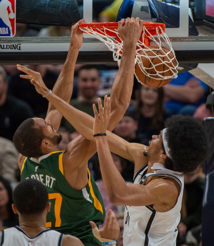 (Rick Egan  |  The Salt Lake Tribune) Utah Jazz center Rudy Gobert (27) dunks the ball over Brooklyn Nets center Jarrett Allen (31), in NBA action between Utah Jazz and Brooklyn Nets, at  Vivint Smart Home Arena, Saturday, March 17, 2019.


