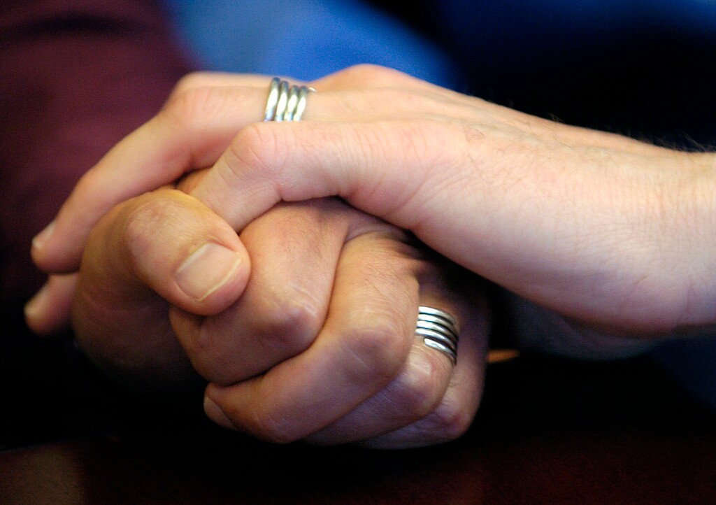 (Benjamin Sklar | The Associated Press) In this June 30, 2006, file photo, a couple displays their wedding bands in San Francisco. 