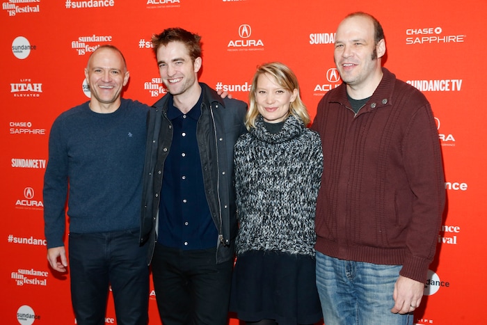 Actor Robert Pattinson, second left, and actress Mia Wasikowska, third left, and directors, screenwriters and actors David Zellner, left, and Nathan Zellner, right, pose at the premiere of "Damsel" during the 2018 Sundance Film Festival on Tuesday, Jan. 23, 2018, in Park City, Utah. (Photo by Danny Moloshok/Invision/AP)