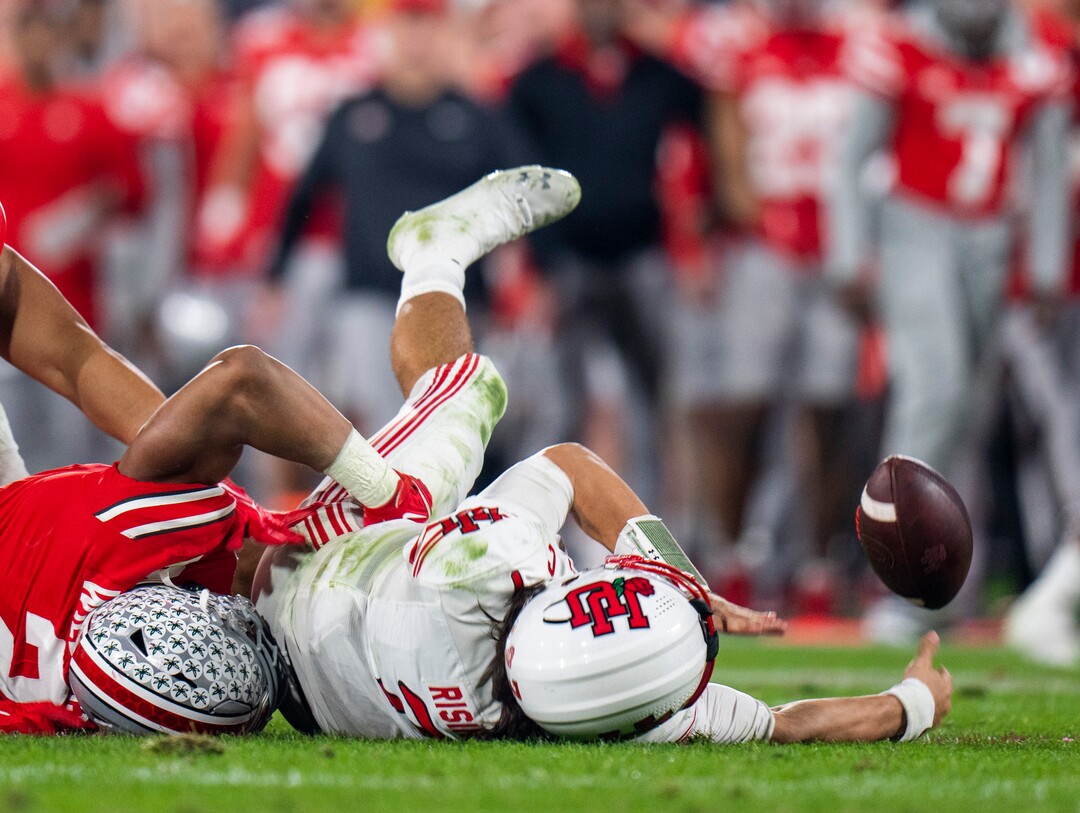(Rick Egan | The Salt Lake Tribune) Utah quarterback Cameron Rising (7) is brought down Ohio State Buckeyes safety Kourt Williams II as he tries to get rid of the ball. Rising was shaken up on the play as was taken out of the game after the play, in Rose Bowl action between the  Utah Utes and the Ohio State Buckeyes Pasadena, on Saturday, January 1, 2022.