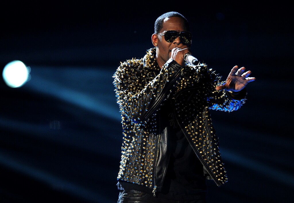 (Frank Micelotta | Invision | The Associated Press) In this June 30, 2013, file photo, R. Kelly performs onstage at the BET Awards at the Nokia Theatre in Los Angeles.  R. Kelly says the media are attempting to distort and destroy his legacy by reporting allegations that he sexually mistreats women. The R&B artist says in a statement Friday, May 4, 2018  that he's "heartbroken" by the accusations.
