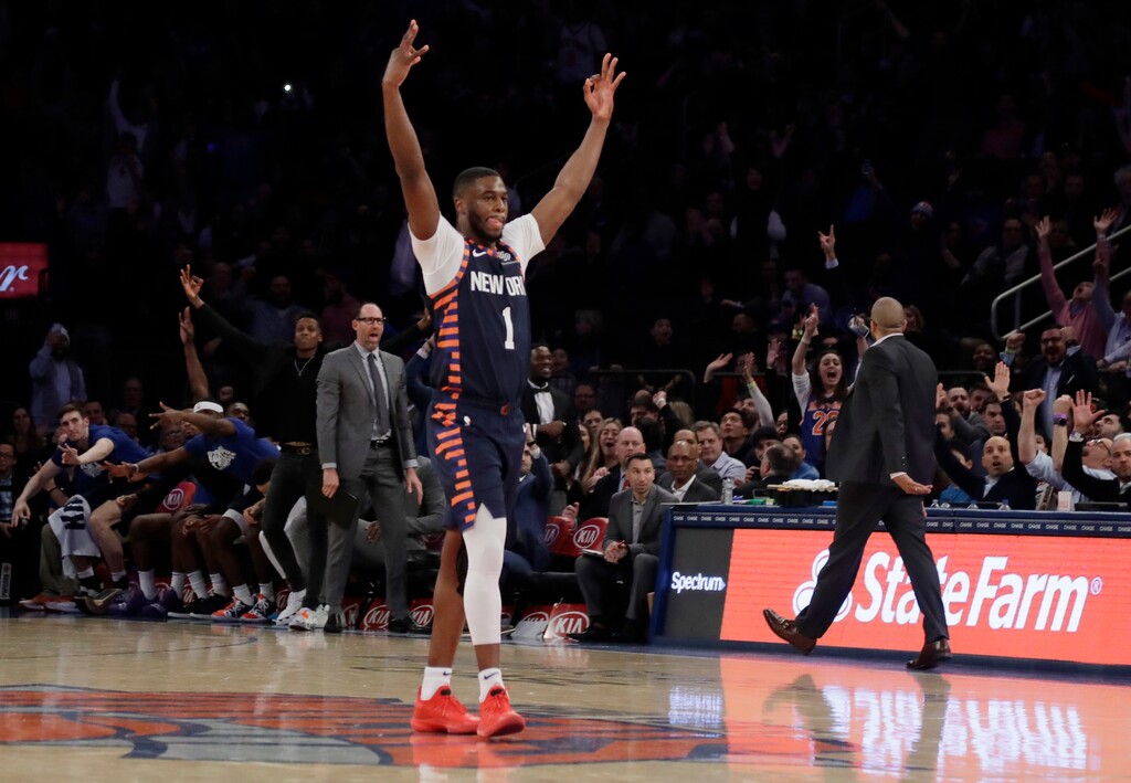 New York Knicks' Emmanuel Mudiay (1) celebrates after Henry Ellenson made a 3-point basket during the second half of the team's NBA basketball game against the Orlando Magic on Tuesday, Feb. 26, 2019, in New York. The Knicks won 108-103. (AP Photo/Frank Franklin II)