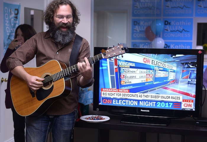 (Leah Hogsten  |  The Salt Lake Tribune) Otter Creek guitarist Peter Danzig plays a song at Utah's 3rd Congressional District Democratic candidate Kathie Allen election night party headquarters in Holladay.  Allen faced faced Republican Provo Mayor John Curtis and the new United Utah Party’s Jim Bennett, as well as a handful of independent and third-party candidates in Tuesday, Nov. 7 special election after former Rep. Jason Chaffetz vacated the seat.