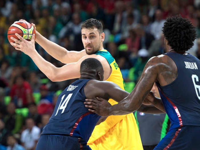 Rick Egan  |  The Salt Lake Tribune
Draymond Green (14) and DeAndre Jordan (6) of United States guard Andrew Bogut (6) of Australia, in Olympic basketball action, USA vs. Australia,  in Rio de Janeiro, Wednesday, August 10, 2016.