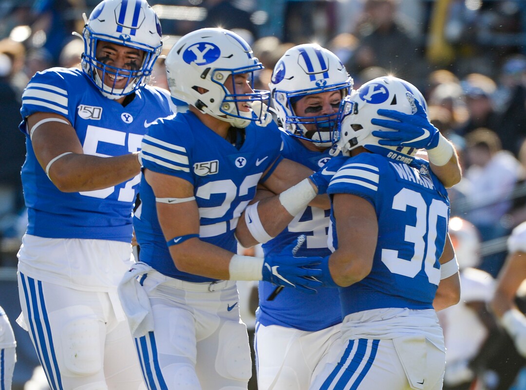 (Leah Hogsten  |  The Salt Lake Tribune) Brigham Young Cougars defensive back Will Watanabe (30) is celebrated after picking up a blocked kick as Brigham Young University takes on Idaho State, Saturday, Nov. 16, 2019 at LaVell Edwards Stadium.