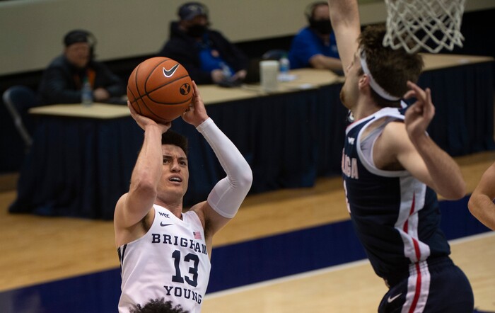 (Rick Egan | The Salt Lake Tribune)  Brigham Young Cougars guard Alex Barcello (13) shoots as Gonzaga Bulldogs forward Drew Timme (2) defends, in West Coast Conference Basketball action between the Brigham Young Cougars and the Gonzaga Bulldogs at the Marriott Center in Provo, on Monday, Feb. 8, 2021.
