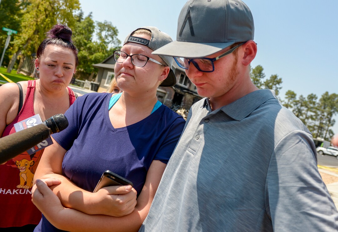 Leah Hogsten  |  The Salt Lake Tribune  "None us us saw this coming," said Joslyn Youd, 21, with her brother Parker Youd, 17, talking about her father Duane "Rhedd" Youd near the house at 584 E. East Canyon Road in Payson where Youd, 47, crashed a plane about 2:30 a.m., Monday, August 13, 2018. Youd died in the plane crash. Firefighters arrived to find the home engulfed in flames. The two people inside the home escaped through the back of the home and were uninjured. Youd had been booked into the Utah County Jail about 7:30 p.m. Sunday after being suspected of assaulting his wife. He bailed out of jail; returned to the home with a police officer about midnight to retrieve belongings and his truck; and left without incident. The Youd's half sister Janna Hanson is at left. 