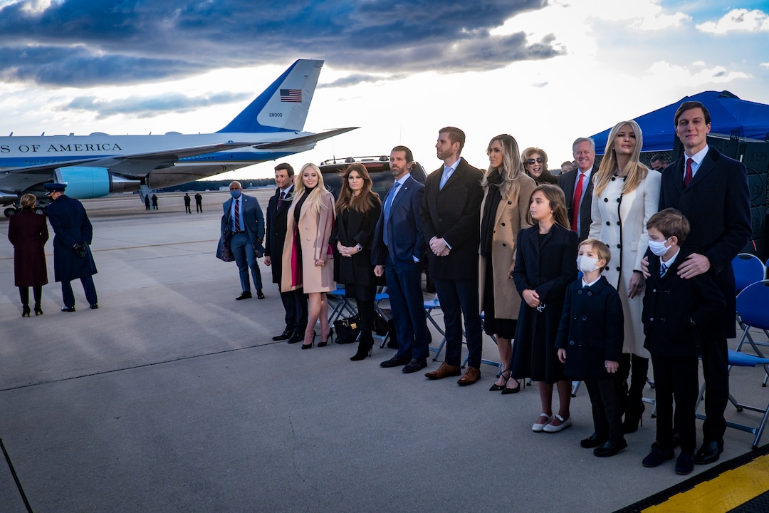 Members of President Donald Trump's family wait for him to speak to supporters before boarding Air Force One for his last time as president at Joint Base Andrews in Maryland, Jan. 20, 2021. Defeated and twice impeached, the 45th president used his farewell remarks before a sparse crowd to brag about his record and wish luck to the incoming administration. (Pete Marovich/The New York Times)