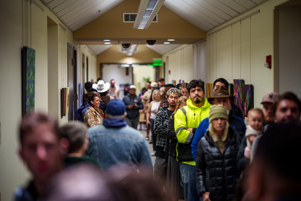 (Trent Nelson | The Salt Lake Tribune) Voters wait in line at the Utah County Health and Justice Building polling station in Provo on Tuesday, Nov. 5, 2024.