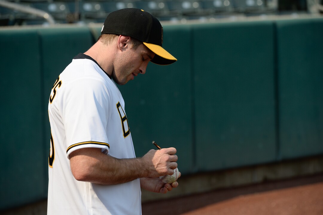 (Francisco Kjolseth  |  The Salt Lake Tribune)  Members of the cast from the movie "The Sandlot," including Phillips (Wil Horneff) signs a ball for a young fan as the Salt Lake Bees celebrate the 25th anniversary of the Utah-filmed movie at the Smith's Ballpark on Friday, Aug. 10, 2018.