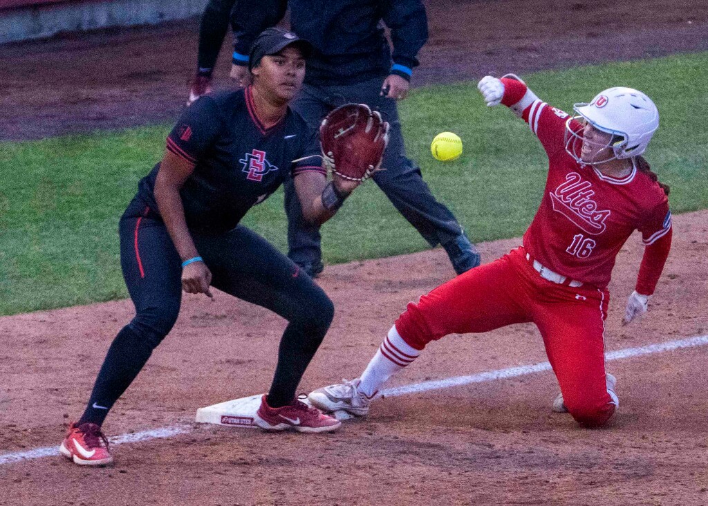 (Rick Egan | The Salt Lake Tribune)  Abby Dayton beats the throw to third base, in NCAA playoff action between the Utah Utes and the San Diego State Aztecs, on Friday, May 26, 2023.