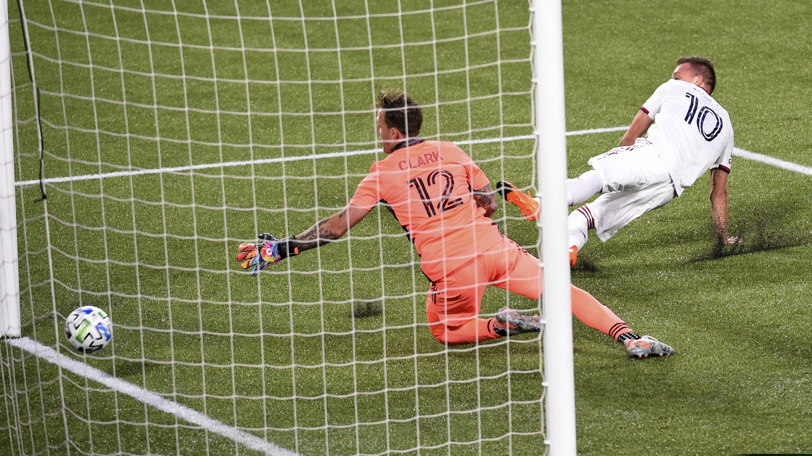 Real Salt Lake forward Corey Baird, right, scores past Portland Timbers goalkeeper Steve Clark, left,during the first half of an MLS soccer match in Portland, Ore., Saturday, Aug. 29, 2020. P Photo/Steve Dykes)