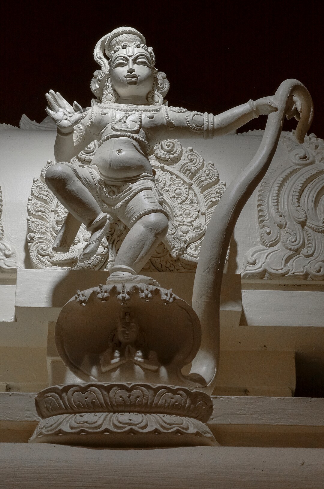 Leah Hogsten  |  The Salt Lake Tribune  Sri Krishna  is worshipped as a major deity in Hinduism. He is the god of compassion, love and tenderness. Krishna is depicted (above) as a child, who after hearing that the snake Kaliya had poisoned the waters of the people of Gokul, jumped on the hood of the snake and pulled its tail. Recognizing Krishna's divinity, the serpent Kaliya bowed to the Lord asking forgiveness. Artisans from around the world spent two years hand-carving deities in the Sri Ganesha Hindu Temple in South Jordan. 