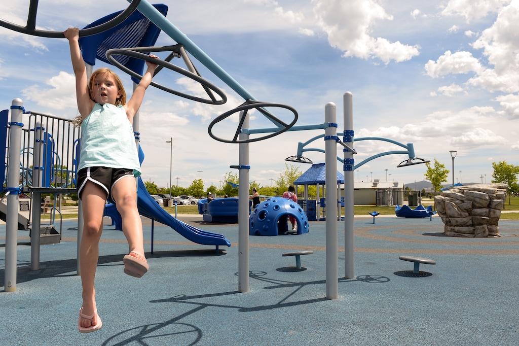 (Chris Samuels | The Salt Lake Tribune) Bryn Swenson, 5, swings on the playground at Sierra Newbold Memorial Playground in West Jordan, Thursday, May 26, 2022.