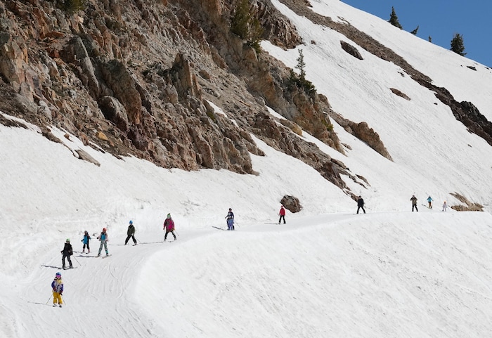 (Francisco Kjolseth  | The Salt Lake Tribune) Skiers hit Mineral Basin as Snowbird closes the book on the 2024-25 ski season on Monday, May 26, 2025. Snow and sun revelers took to the slushy slopes on Memorial Day as the resort was the last in the state to close.