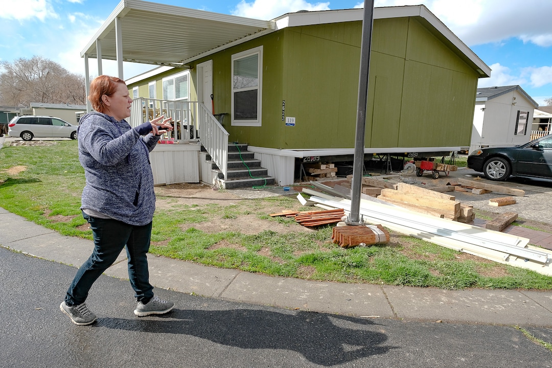 (Francisco Kjolseth  |  The Salt Lake Tribune) Celeste Tunno, a resident of the Western Estates mobile home park in Magna talks about some of the damage sustained to her home following last week's earthquake on Monday, March 23, 2020, as her husband risks shoring up their home with wood blocks despite continued aftershocks.