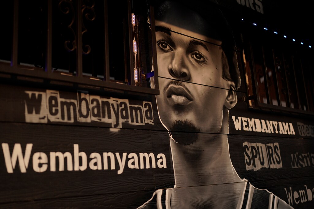 A mural of Victor Wembanyama, a 7-foot-3 French basketball star, painted by artist Nik Soupe is seen on a seafood restaurant in San Antonio, Thursday, June 15, 2023. The San Antonio Spurs are expected to make Wembanyama the No. 1 pick in the NBA draft. (AP Photo/Eric Gay)