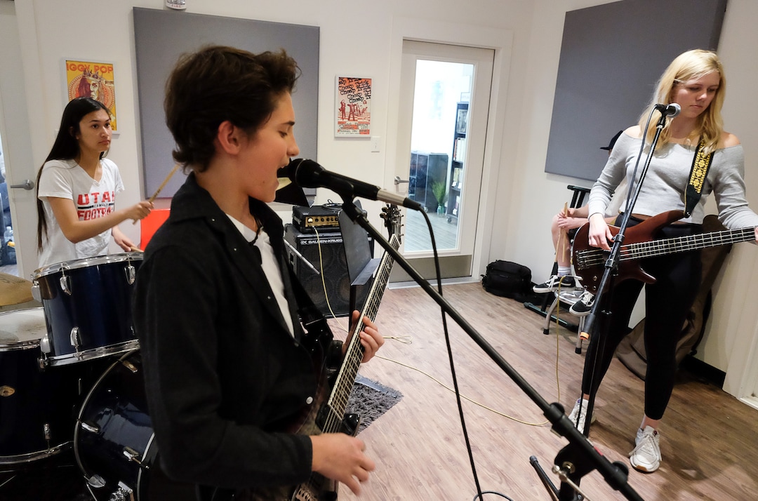 (Francisco Kjolseth  |  The Salt Lake Tribune)  Students jam together at MusicGarage.org, after school program in Sugarhouse, including Cassidy Azarcom, 15, Tega Hamlin, 13, and Tallulah Schweitz, 16, on Monday, May 20, 2019, as they learn to rock and roll in hopes of joining a kids band to perform at festivals this Summer.