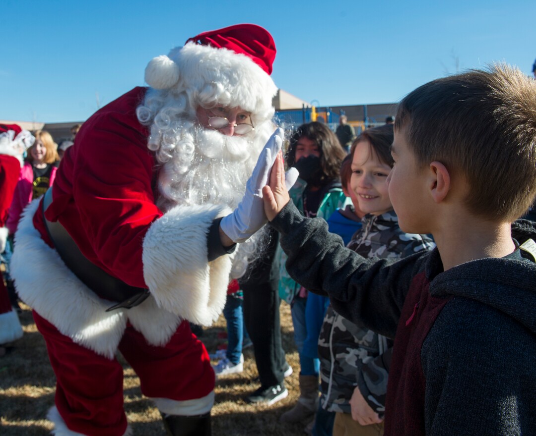 (Rick Egan  |  The Salt Lake Tribune) Santa greets students at Centennial Elementary School, in Roosevelt, Utah, as volunteer pilots from the Utah Wing of Angel Flight West,  brought school supplies and gifts to students in Roosevelt on their annual Santa Flight. Friday, December 8, 2017.